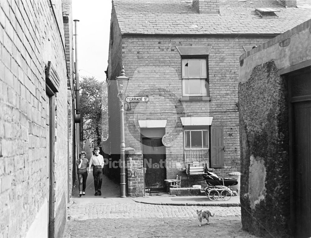 Teenagers in an alley beside No 33 Terrace Street, Hyson Green