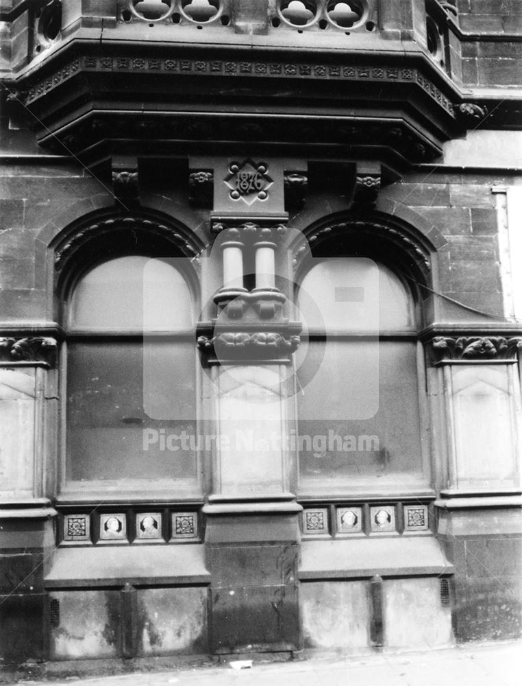 Widows, datestone and glazed tiles, architectural detail - The Express Building