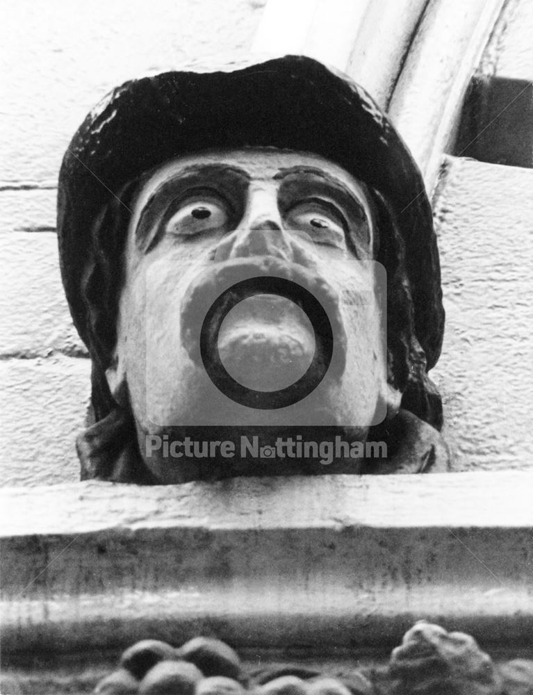 The Dog and Bear public house - sculptured head on window lintel keystone