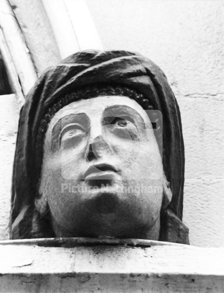 The Dog and Bear public house - sculptured head on window lintel keystone