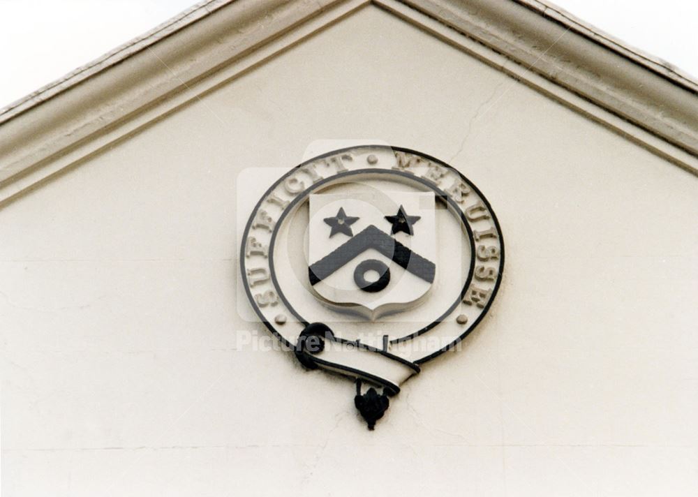 Plumptre Hospital - coat of arms in the hospital gable.