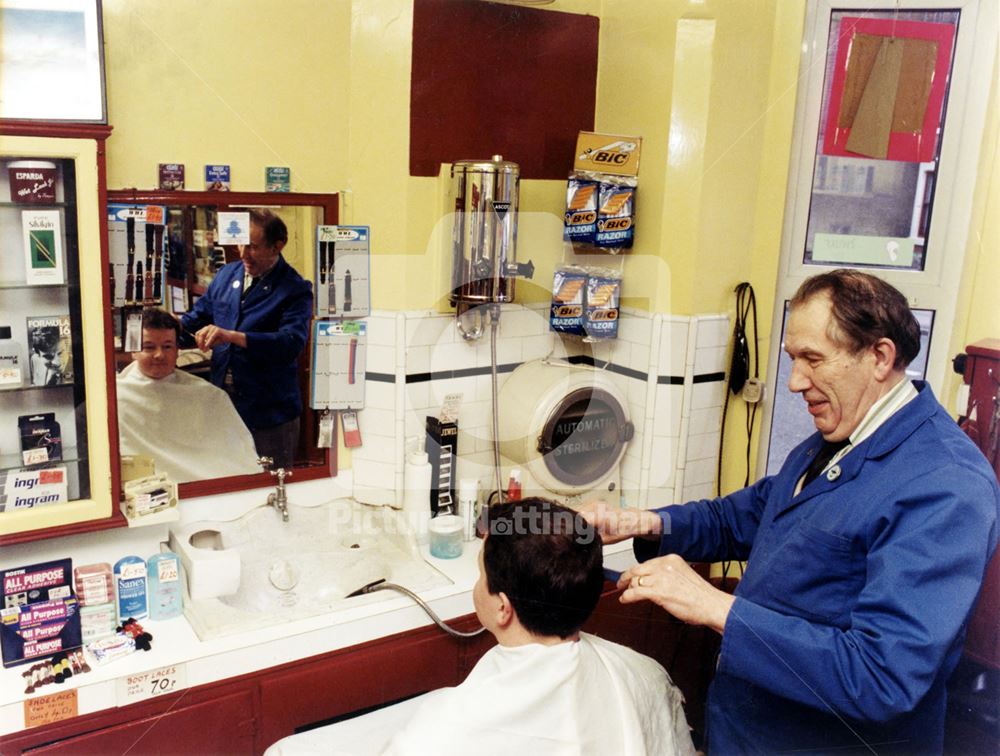 Bill Bush in the salon of his barber's shop, Colwick Road, Sneinton