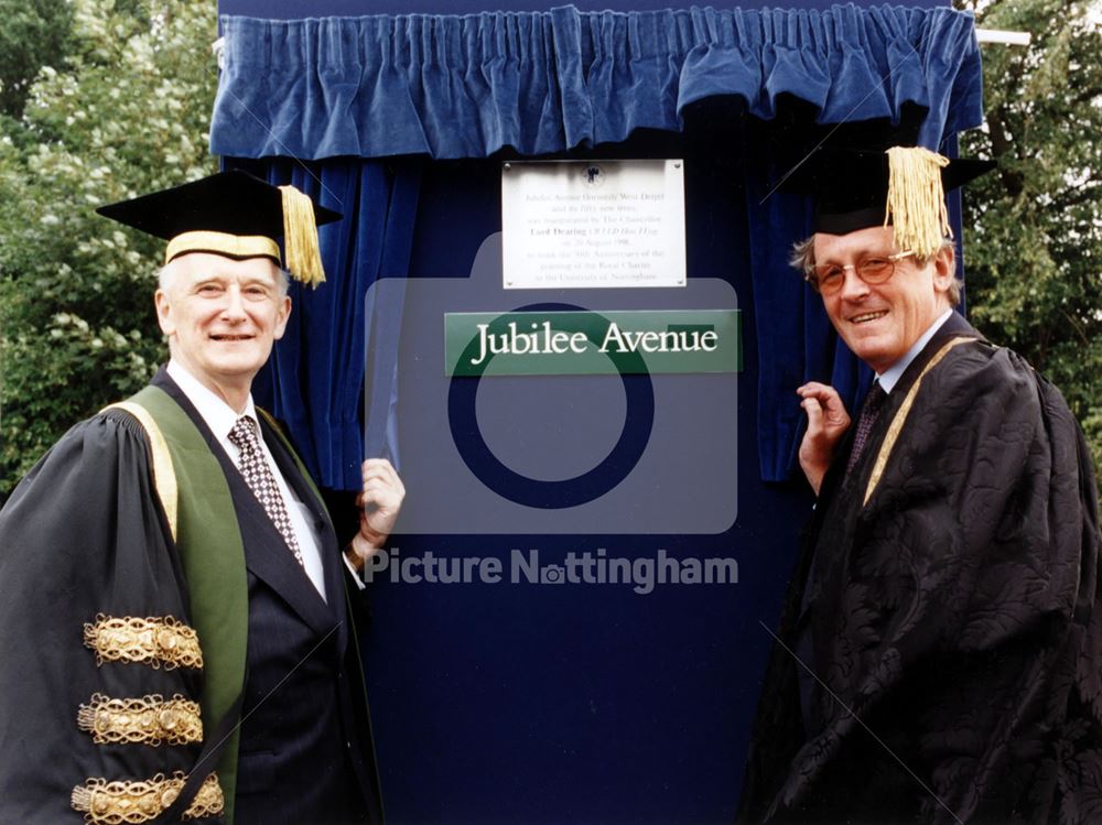 Lord Dearing (L) and Vice Chancellor Sir Colin Campbell unveil a plaque for the Golden Jubilee of th