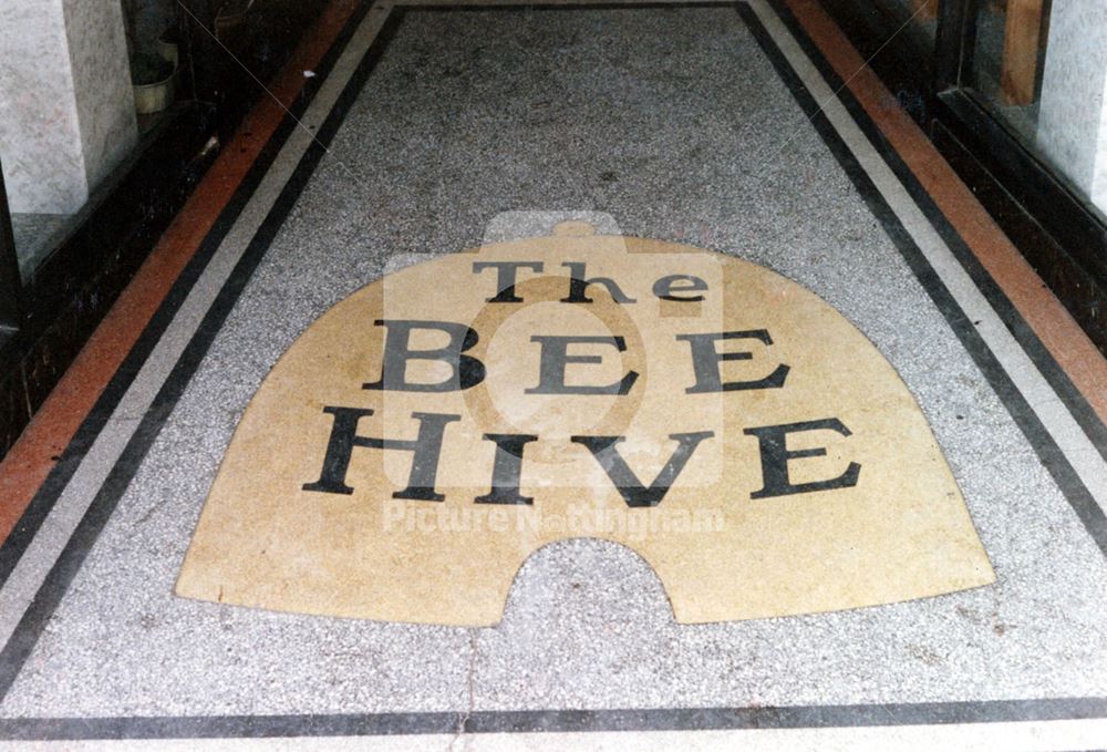 Tiled entrance to the former Beehive Cafe