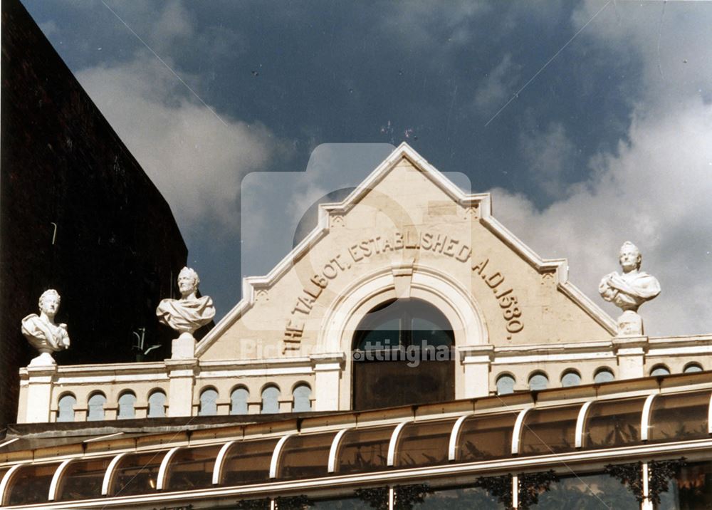 The Talbot Inn (Yates' Wine Lodge) - architectural detail of gable end with busts