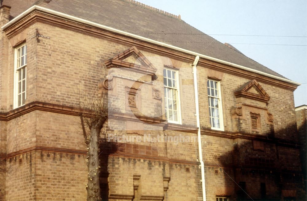 Sycamore School - architectural detail of corbelled brickwork and datestone