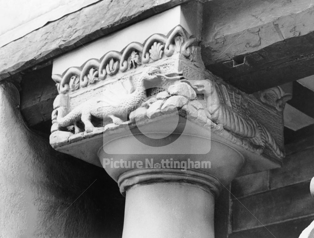 Animal/dragon stone carvings on the column capitals at 44 Castle Gate