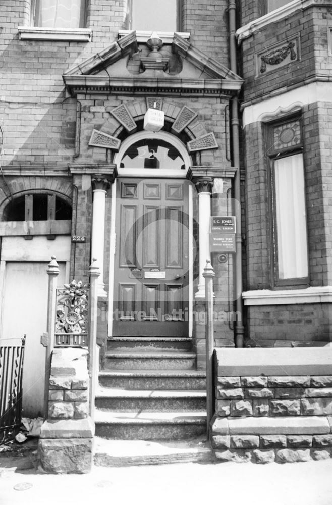 Ornate doorway in brick and terracotta to the Dentist's Surgery at 224 Alfreton Road