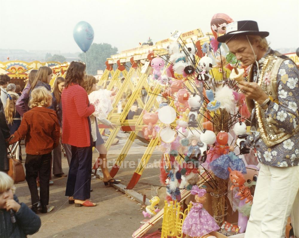 Goose Fair - Toy seller and childrens swingboat rides