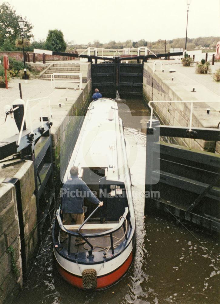 Narrowboat passing through Beeston Canal Lock at the junction with the River Trent