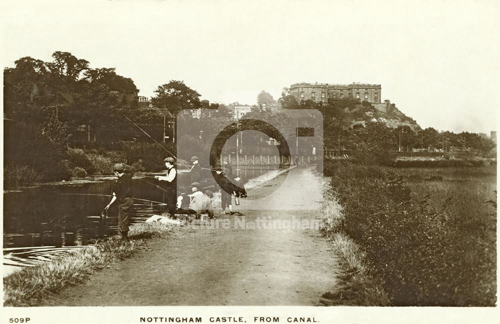 Boys fishing on the Nottingham Canal, next to Castle Boulevard looking towards Nottingham Castle