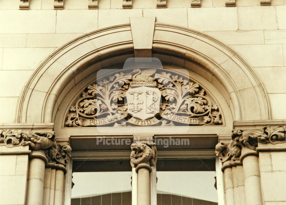 Sculpture in the tympanum above the window of the former Water Dept. Offices