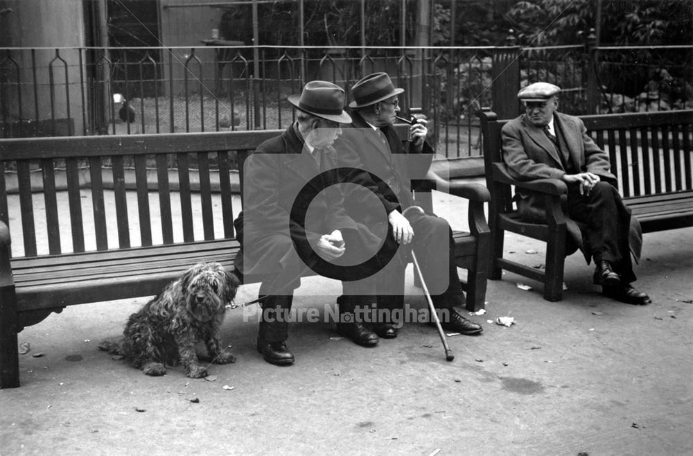 Men on benches by the aviaries - Nottingham Arboretum