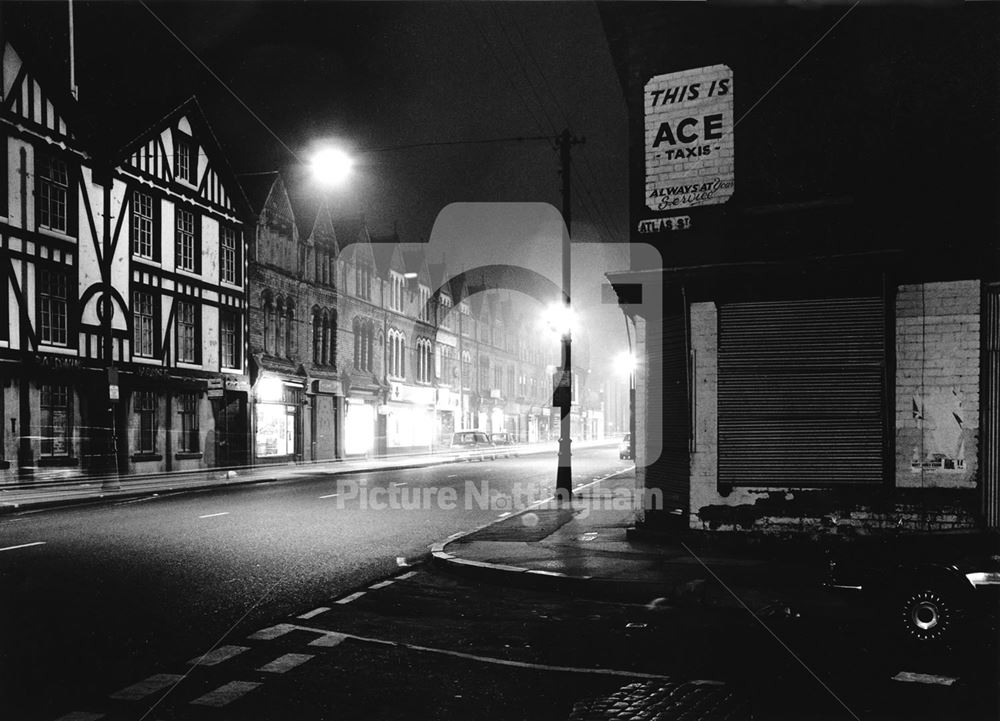 Arkwright Street at night, showing the half-timbered Baldwin House