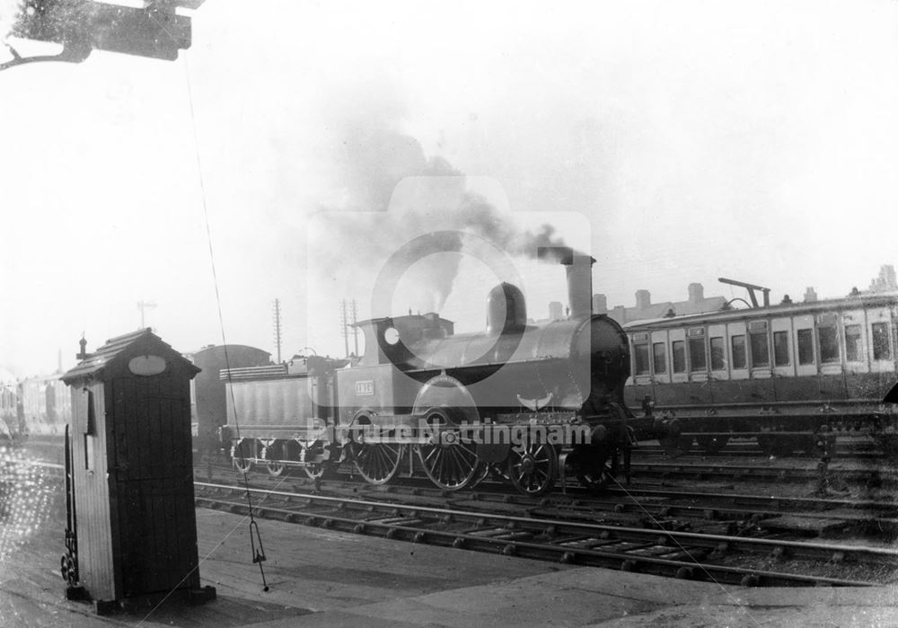 A (Victorian ?) locomotive no 1214 and train at the London Road Low Level Station