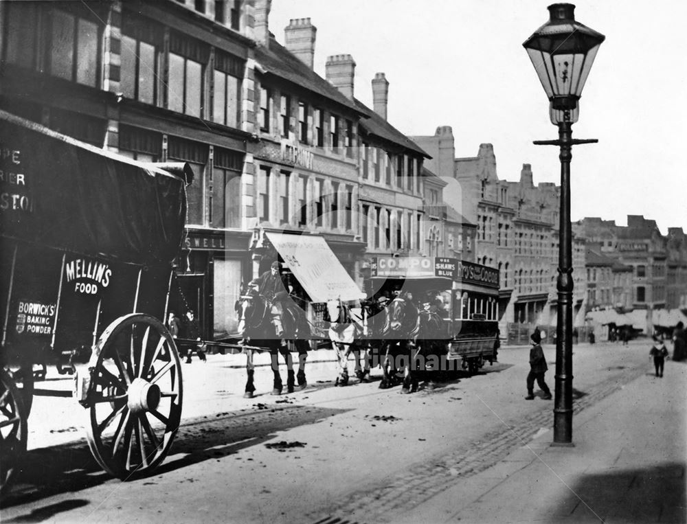 A large cock horse pulling a horse tram up Derby Road