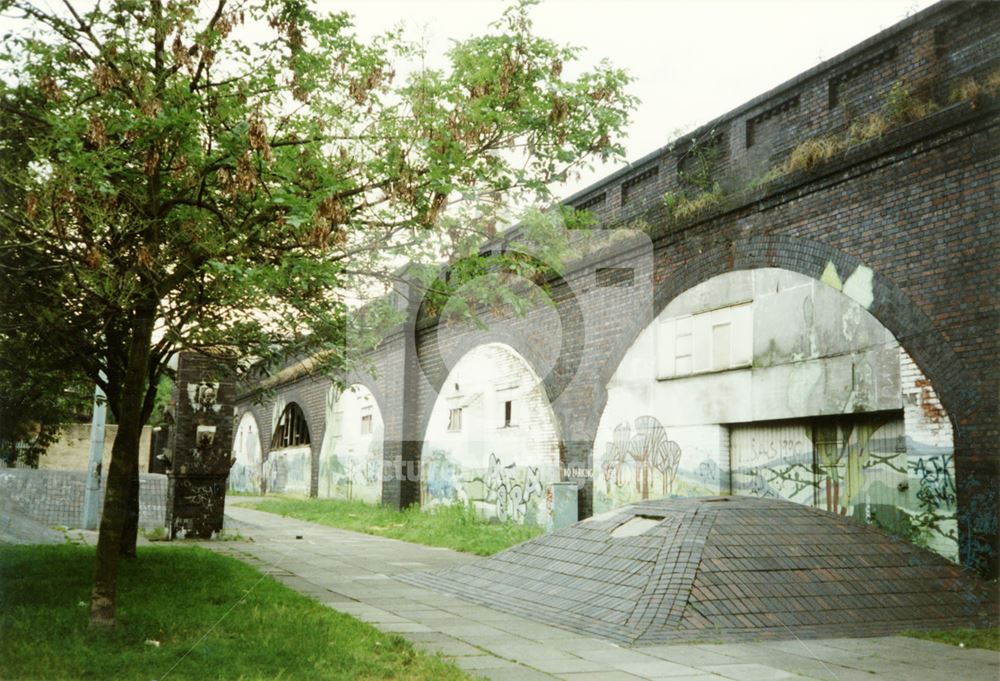 Murals in the brickwork arches of the Weekday Cross Junction viaduct