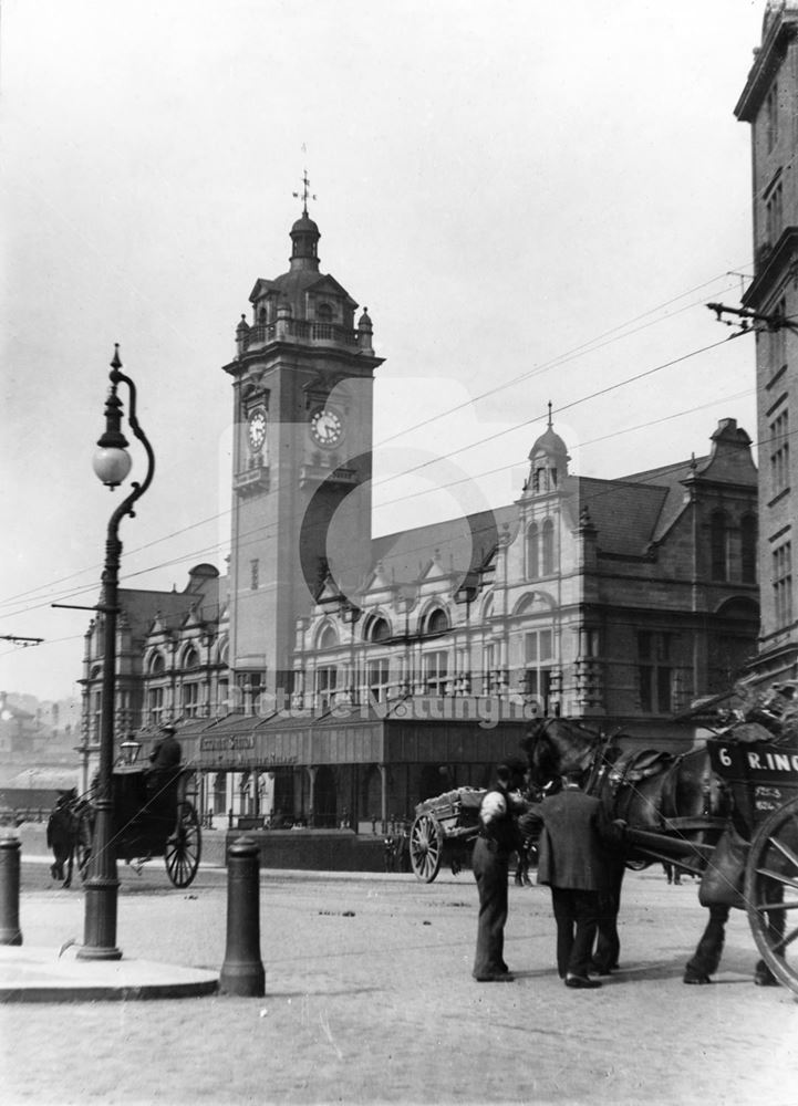 Hansom cab and carts in front of Victoria Railway Station