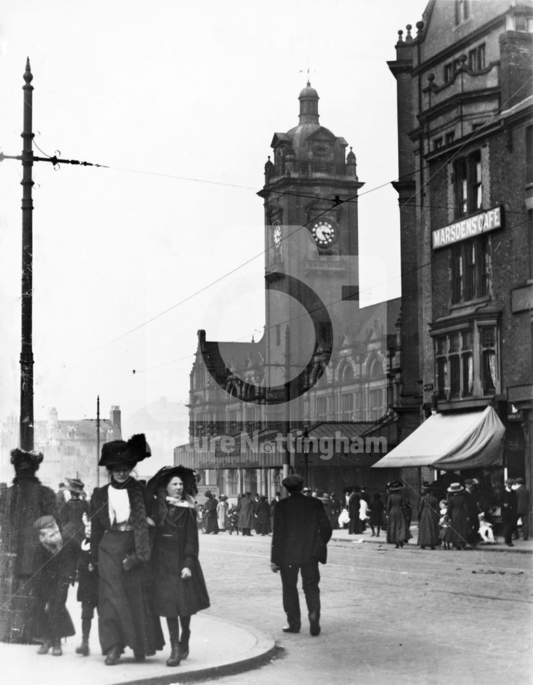 People on Milton Street in front of Victoria Railway Station