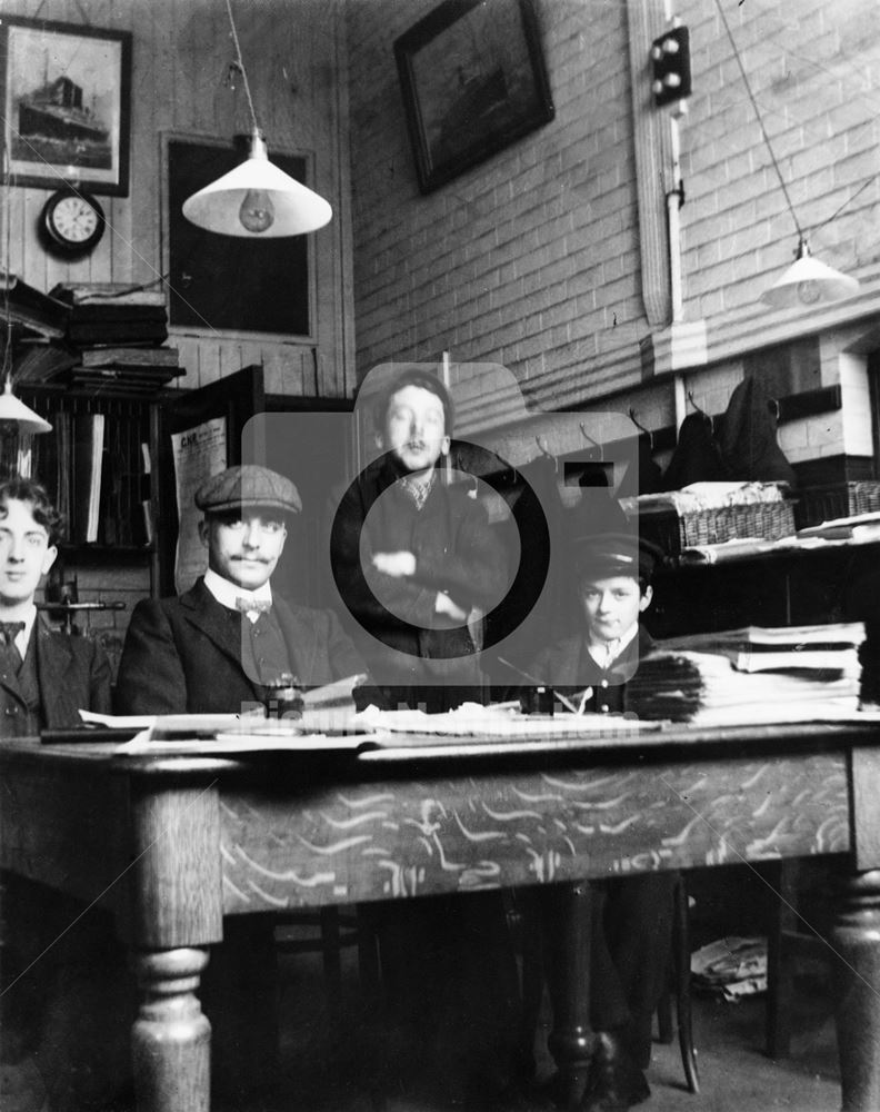 Great Northern Railway workers sitting in an unidentified office