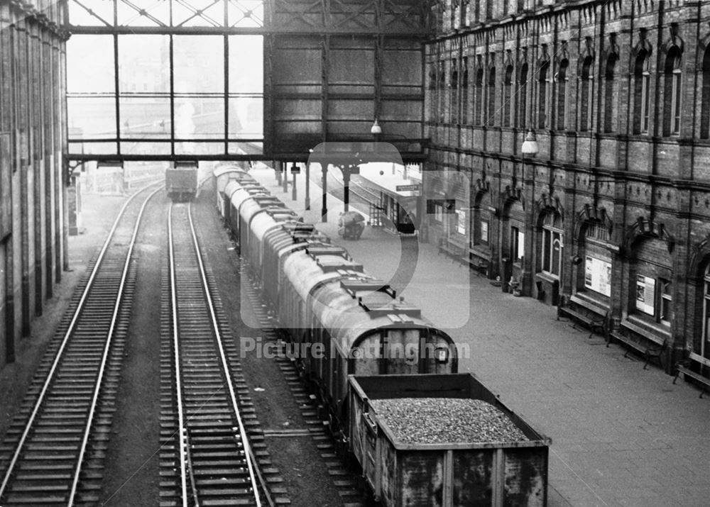 Victoria Railway Station interior - goods train with grain wagons alongside a platform