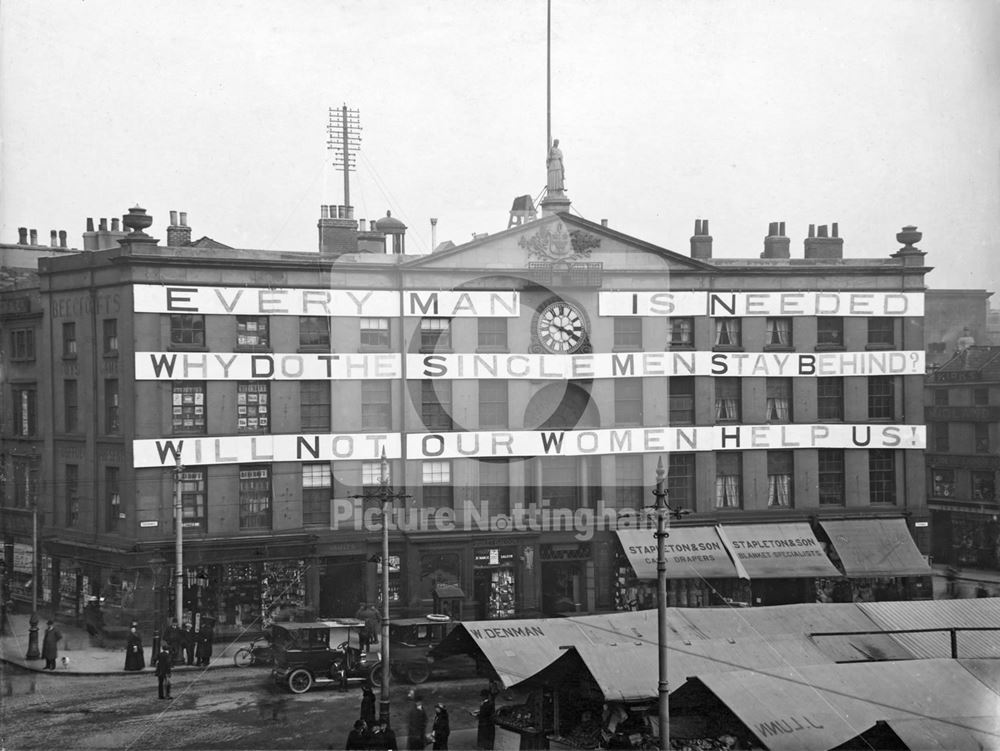 World War 1 propaganda message on the Exchange, coercing men to fight and women to help.