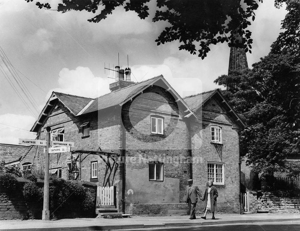 Couple walking along Plumtree Road , Cotgrave