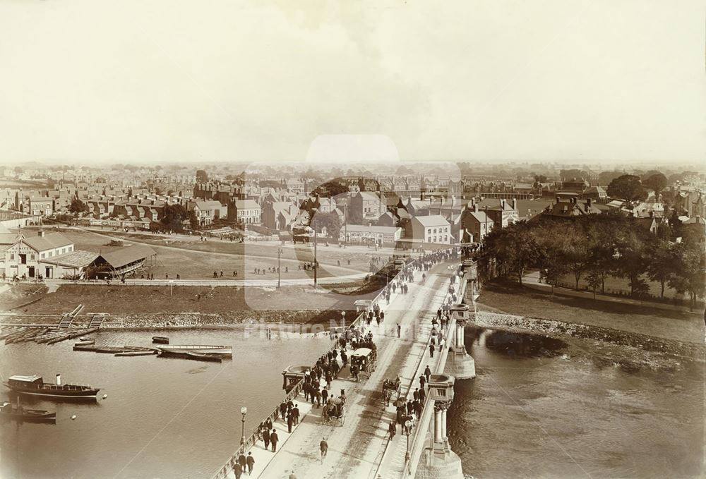 Crowds crossing Trent Bridge, heading to Nottingham Forest Football Club's Ground (centre left)