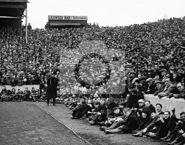 Crowds watching a match at Nottingham Forest Football Club ground