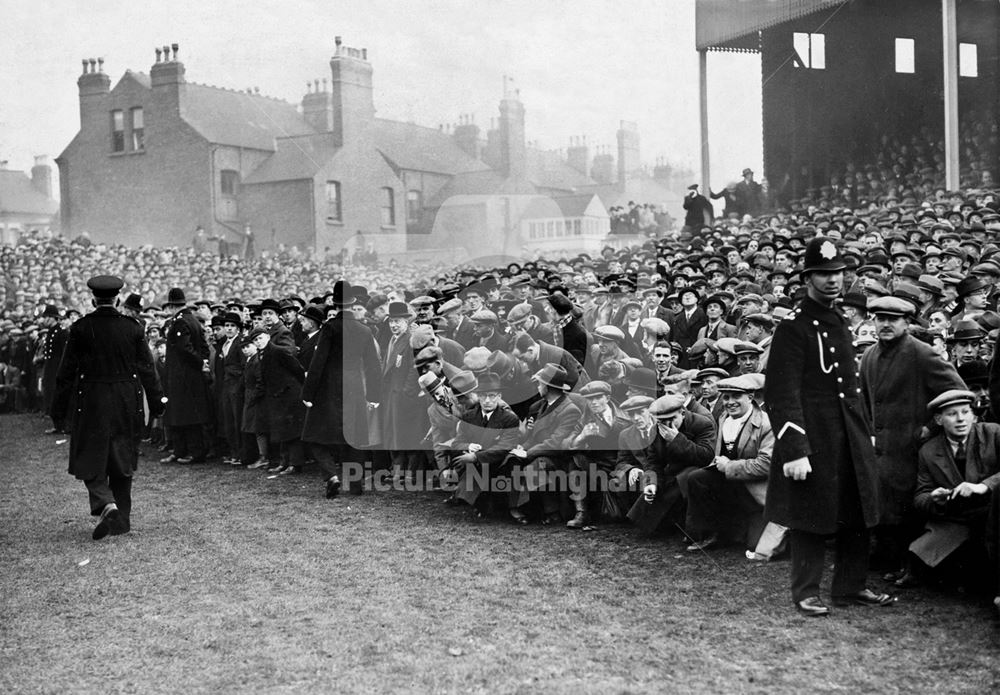 Crowds watching a match at Nottingham Forest Football Club ground - Cup tie between Forest and Chels