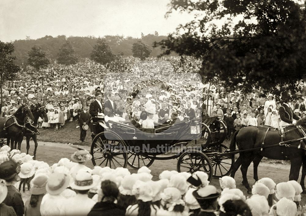 King George V and Queen Mary pass by crowds of schoolchildren on their visit to Nottingham in 1914