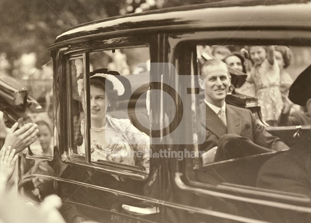 Driving through the streets during the Royal visit of Princess Elizabeth and the Duke of Edinburgh