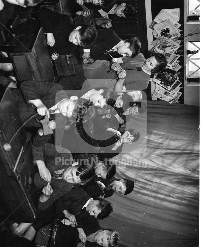 School boys knitting comforts for troops, Gotham, 1939-1940