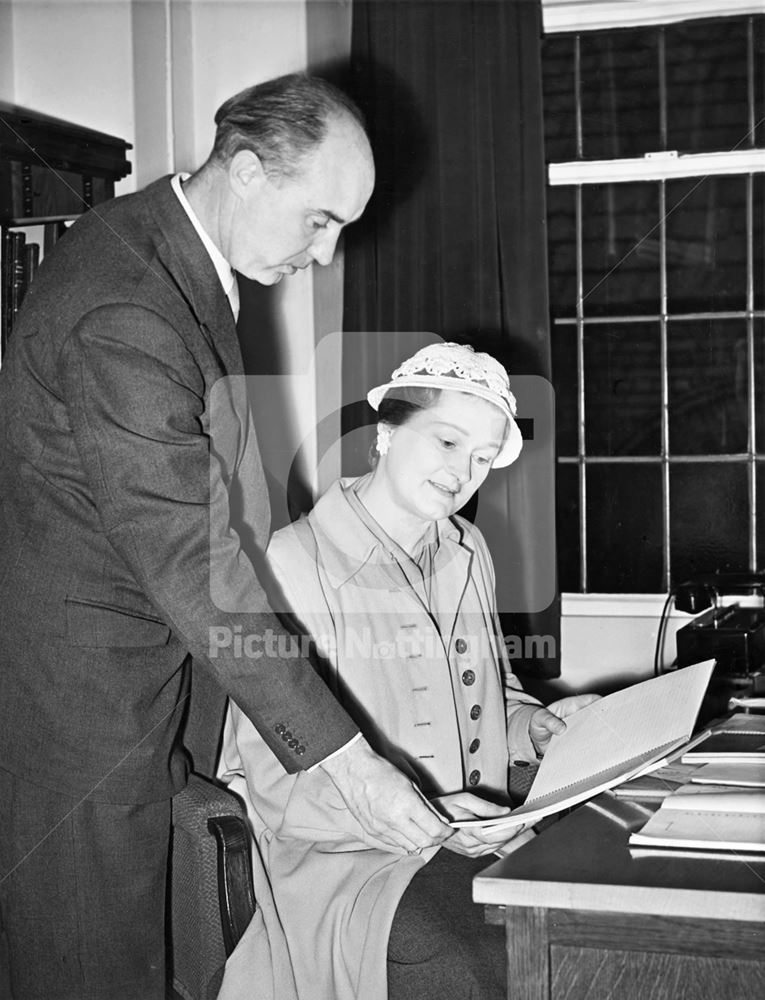 Katharine Morris, author, presenting a manuscript to the City Librarian