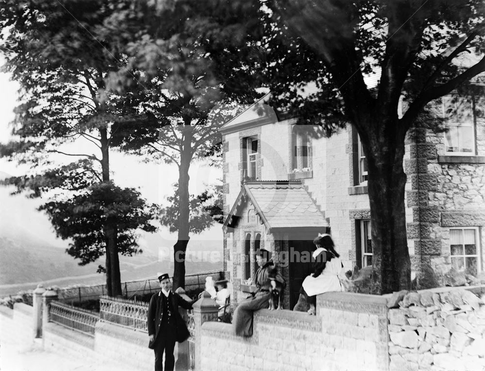 Group in front of house, c 1898