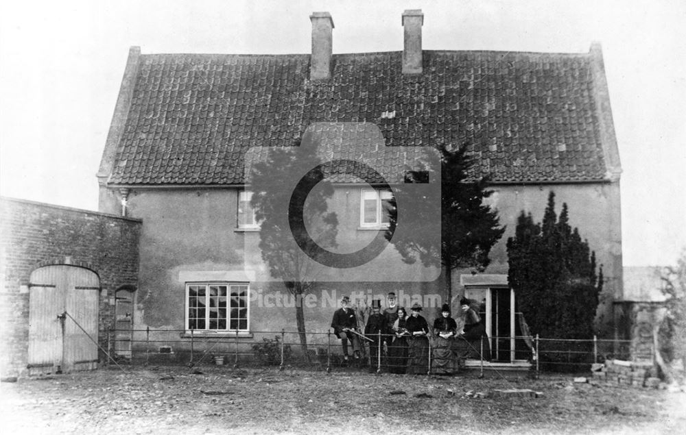 Cottage with family group, Alverton, c 1880