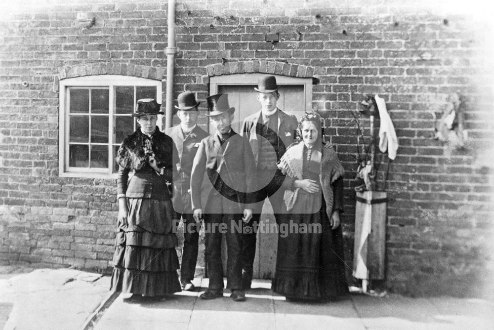 Cottage with family group, Alverton, c 1880