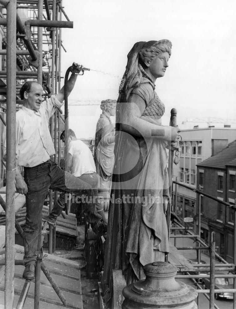 Cleaning statues on pediment, The Guildhall, Burton Street, Nottingham, 1969